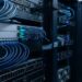 Cat6a Ethernet cable connected to a high-speed network switch